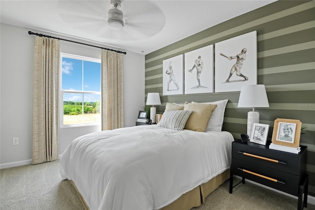 bedroom with carpet floors, baseboards, and a ceiling fan