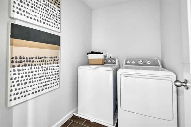 laundry room with washer and dryer, laundry area, and baseboards