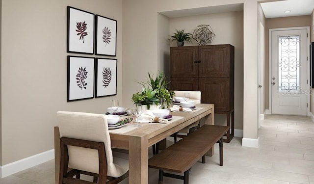 dining room with baseboards