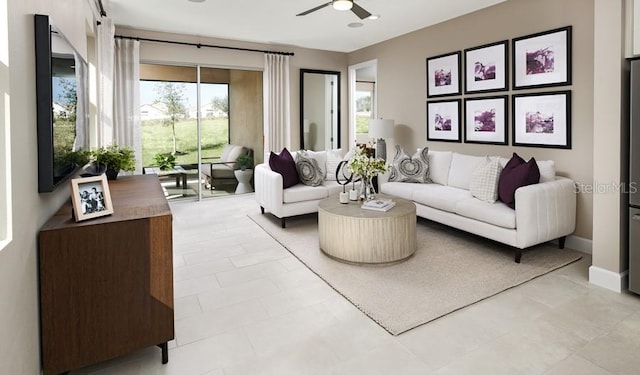 living area featuring ceiling fan and baseboards
