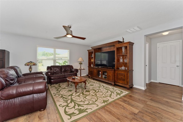 1532 Angler Ave, Kissimmee, FL 34746 - living room featuring baseboards, a ceiling fan, visible vents, and wood finished floors