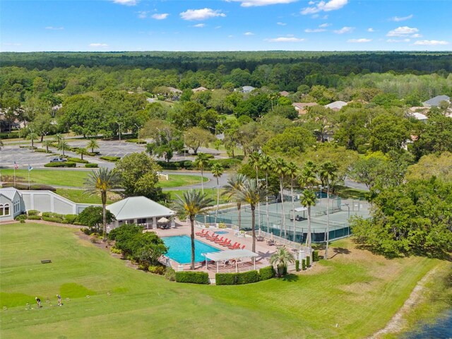 birds eye view of property with a view of trees
