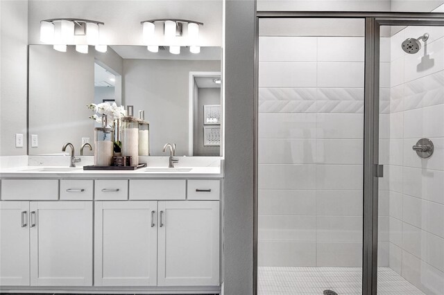 full bath featuring a sink and a shower stall