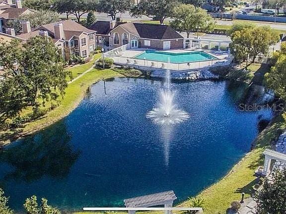 4301 Lizshire Ln Unit 306, Orlando, FL 32822 - aerial view of a pool and a large body of water