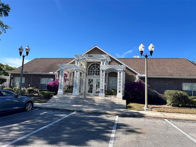 4301 Lizshire Ln Unit 306, Orlando, FL 32822 - view of building exterior featuring uncovered parking
