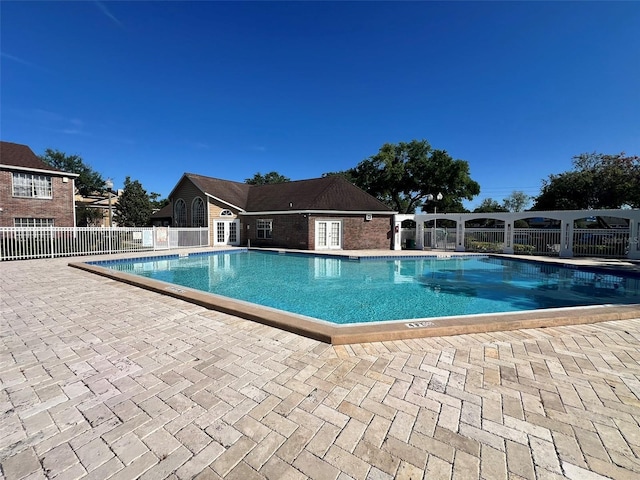 4301 Lizshire Ln Unit 306, Orlando, FL 32822 - community pool with a patio area