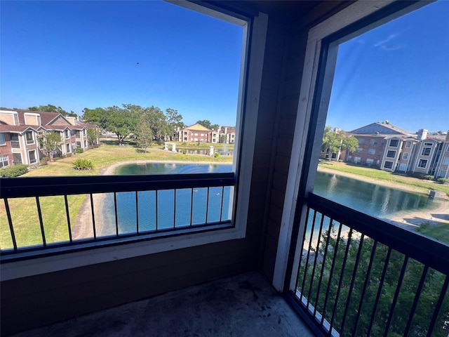 4301 Lizshire Ln Unit 306, Orlando, FL 32822 - balcony featuring a water view and a residential view