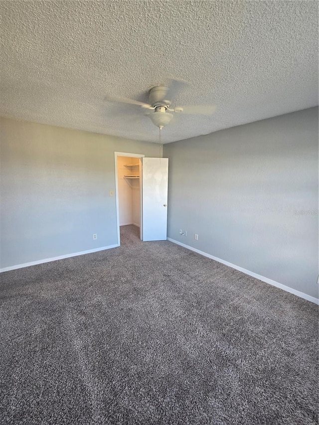4301 Lizshire Ln Unit 306, Orlando, FL 32822 - spare room featuring carpet floors, ceiling fan, baseboards, and a textured ceiling