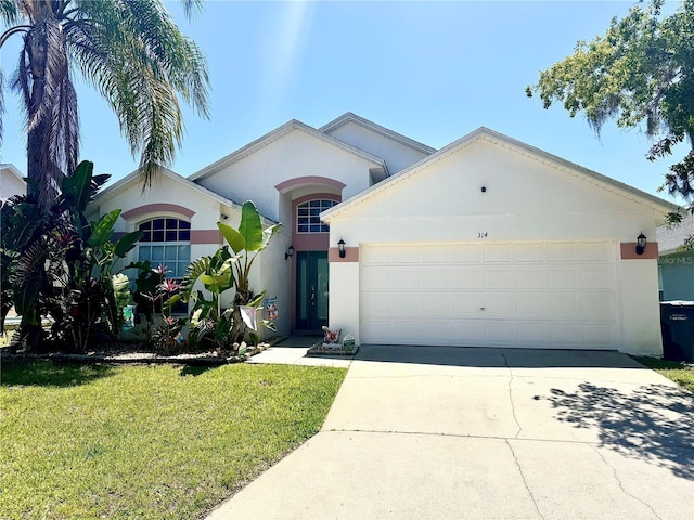 314 Saddle Ridge Dr, Davenport, FL 33896 - ranch-style house featuring concrete driveway, a garage, a front yard, and stucco siding