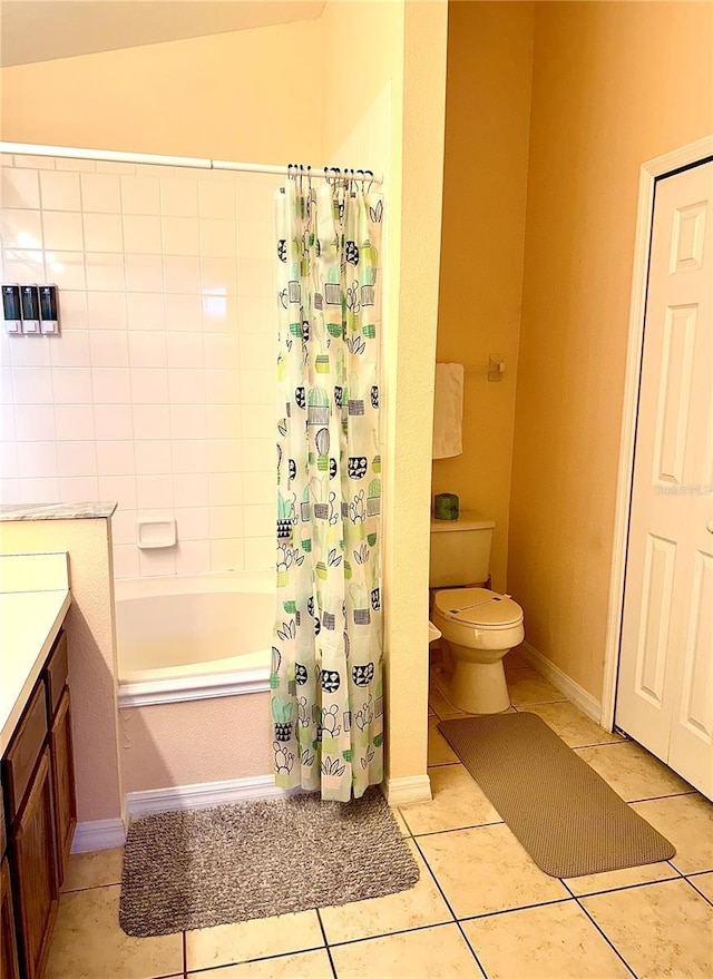 314 Saddle Ridge Dr, Davenport, FL 33896 - bathroom featuring tile patterned floors, toilet, and shower / bath combination with curtain