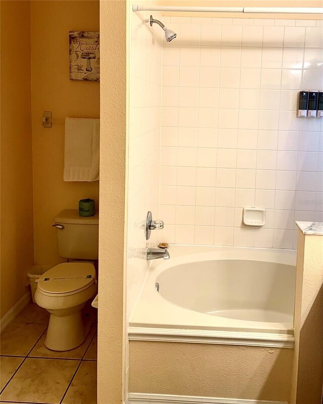 314 Saddle Ridge Dr, Davenport, FL 33896 - full bathroom with tile patterned floors, bathtub / shower combination, and toilet
