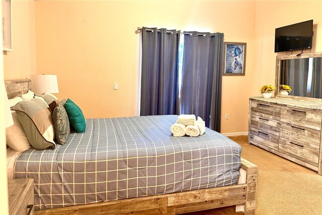 314 Saddle Ridge Dr, Davenport, FL 33896 - bedroom featuring baseboards and carpet