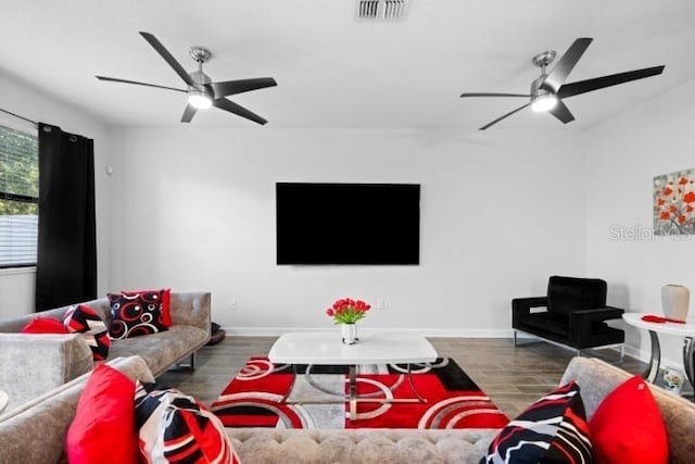 1231 Sandwedge St, Davenport, FL 33896 - living area with baseboards, ceiling fan, visible vents, and wood finished floors