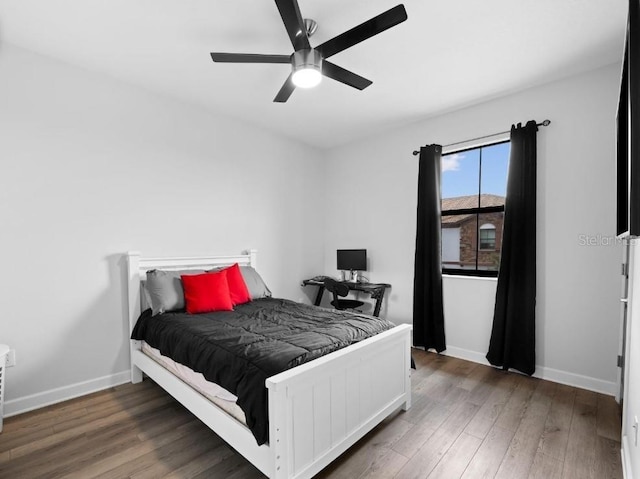 1231 Sandwedge St, Davenport, FL 33896 - bedroom featuring baseboards, ceiling fan, and wood finished floors