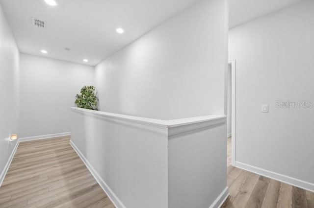 1231 Sandwedge St, Davenport, FL 33896 - corridor featuring recessed lighting, light wood finished floors, baseboards, and visible vents