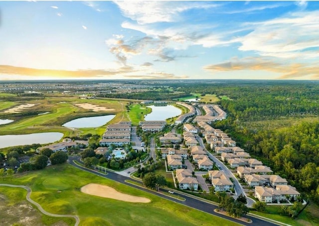 1231 Sandwedge St, Davenport, FL 33896 - aerial view at dusk featuring a residential view, view of golf course, and a water view