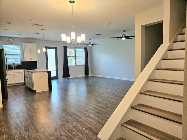 1231 Sandwedge St, Davenport, FL 33896 - kitchen with dark wood-style flooring, visible vents, and a healthy amount of sunlight