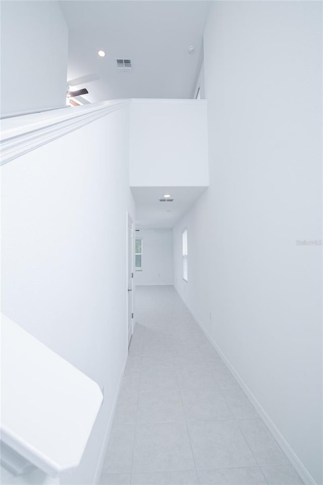 2189 Teneroc Trl, Lakeland, FL 33801 - corridor with recessed lighting, baseboards, visible vents, and light tile patterned floors