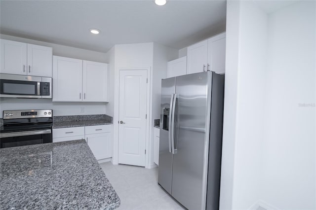 2189 Teneroc Trl, Lakeland, FL 33801 - kitchen with recessed lighting, white cabinetry, and appliances with stainless steel finishes