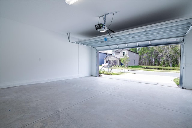 2189 Teneroc Trl, Lakeland, FL 33801 - garage featuring a garage door opener