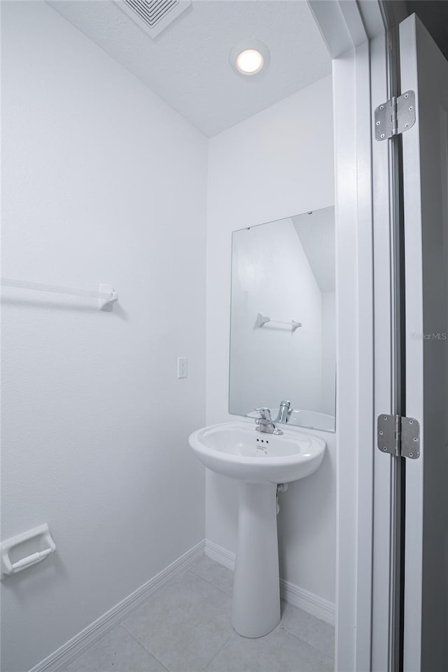 2189 Teneroc Trl, Lakeland, FL 33801 - bathroom with visible vents, baseboards, and tile patterned floors