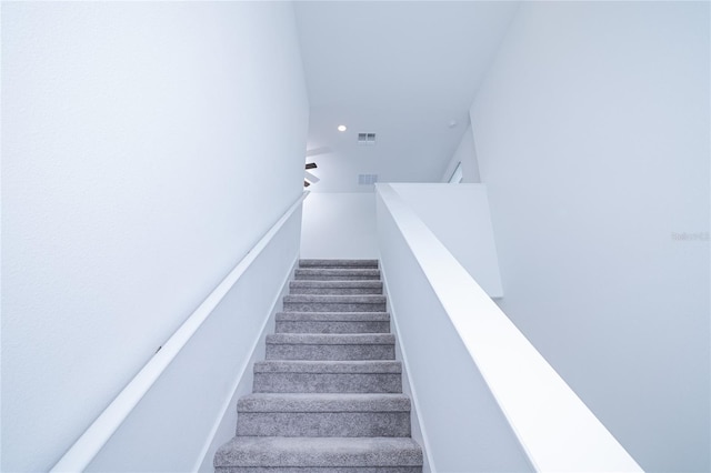 2189 Teneroc Trl, Lakeland, FL 33801 - stairs featuring carpet flooring, recessed lighting, and visible vents