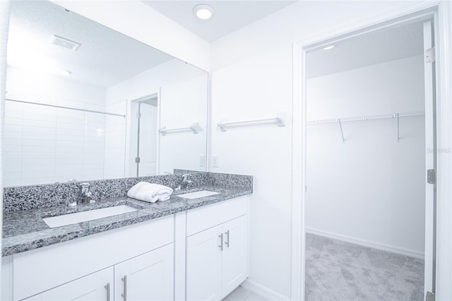 2189 Teneroc Trl, Lakeland, FL 33801 - bathroom with a sink, a spacious closet, double vanity, and visible vents
