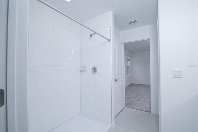 2189 Teneroc Trl, Lakeland, FL 33801 - full bathroom with visible vents, baseboards, tile patterned flooring, and tiled shower