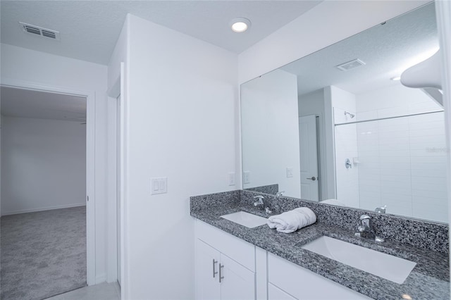 2189 Teneroc Trl, Lakeland, FL 33801 - full bath with tiled shower, visible vents, and a sink