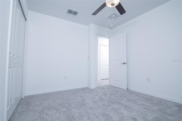 2189 Teneroc Trl, Lakeland, FL 33801 - unfurnished bedroom with visible vents, a closet, baseboards, ceiling fan, and carpet