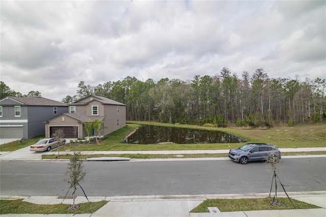 2189 Teneroc Trl, Lakeland, FL 33801 - view of road featuring a water view, a view of trees, and sidewalks