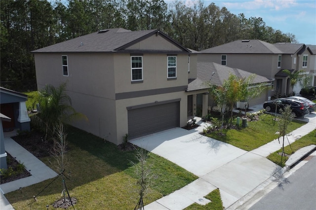 2189 Teneroc Trl, Lakeland, FL 33801 - traditional-style house featuring a garage, a front lawn, stucco siding, a shingled roof, and concrete driveway