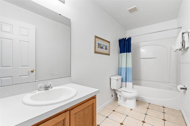 bathroom featuring vanity, toilet, a textured ceiling, baseboards, and visible vents
