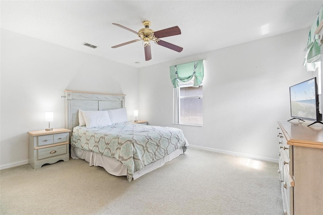 bedroom featuring carpet floors, a ceiling fan, baseboards, and visible vents