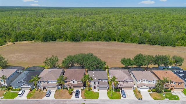 bird's eye view with a forest view and a residential view