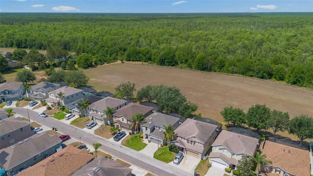 aerial view with a residential view and a wooded view