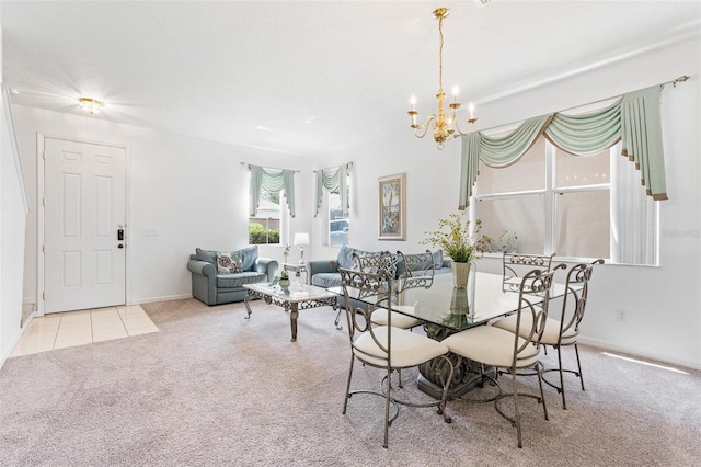 tiled dining room with baseboards, carpet flooring, and a chandelier