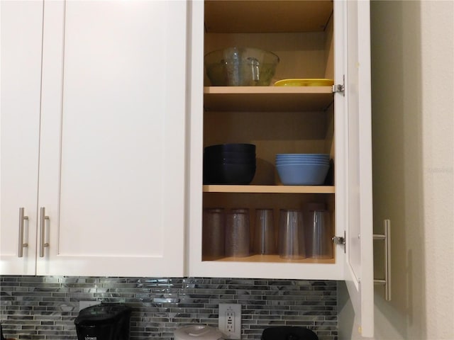 9079 Dogleg Dr, Davenport, FL 33896 - kitchen view of white cabinets, backsplash, and open shelves