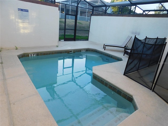 9079 Dogleg Dr, Davenport, FL 33896 - view of pool featuring a swimming pool, glass enclosure, and a patio area