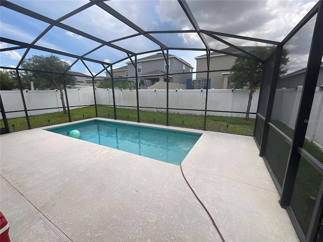 view of pool with a yard, a lanai, a patio, a fenced backyard, and a fenced in pool