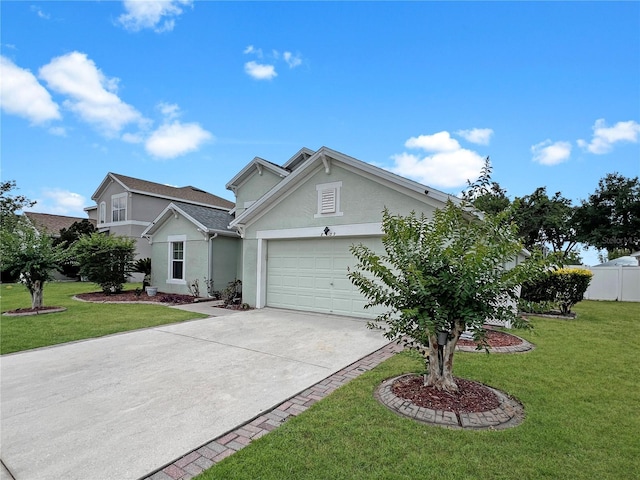 8439 Adele Rd, Lakeland, FL 33810 - view of front of home with driveway, fence, a garage, stucco siding, and a front yard