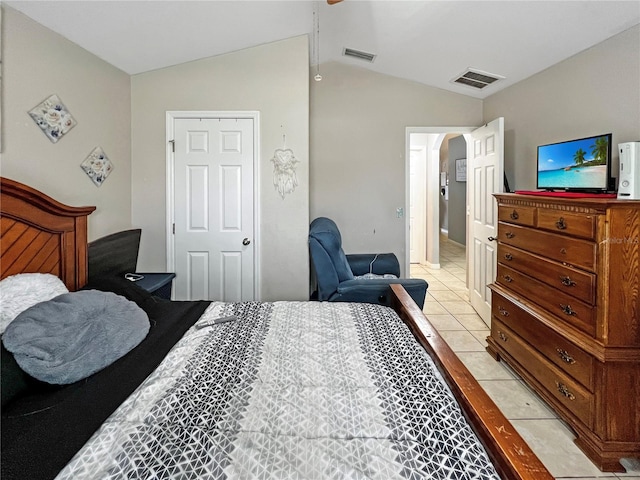 8439 Adele Rd, Lakeland, FL 33810 - bedroom featuring light tile patterned floors, visible vents, lofted ceiling, and arched walkways