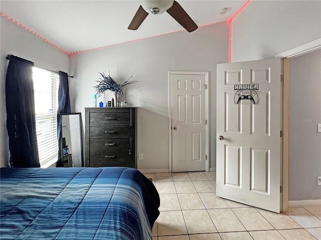 8439 Adele Rd, Lakeland, FL 33810 - bedroom with lofted ceiling, baseboards, light tile patterned floors, and a ceiling fan