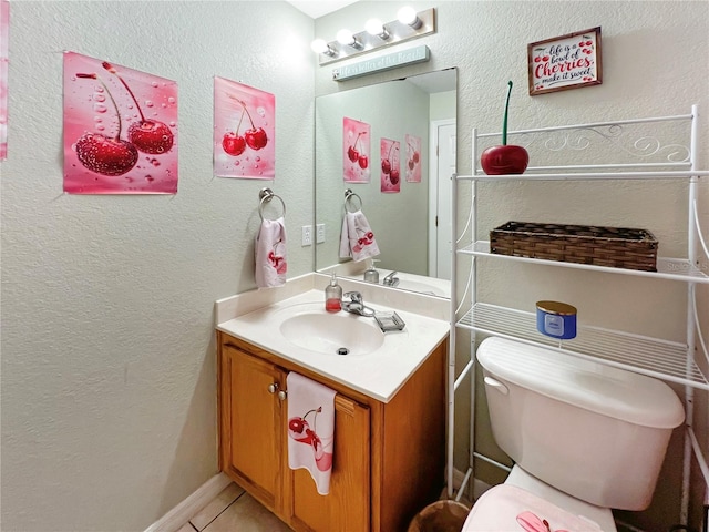 8439 Adele Rd, Lakeland, FL 33810 - bathroom with toilet, tile patterned flooring, vanity, and a textured wall