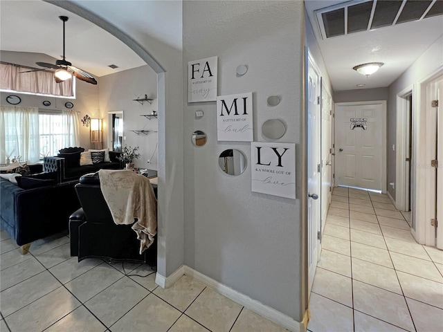 8439 Adele Rd, Lakeland, FL 33810 - corridor with light tile patterned floors, visible vents, baseboards, and arched walkways