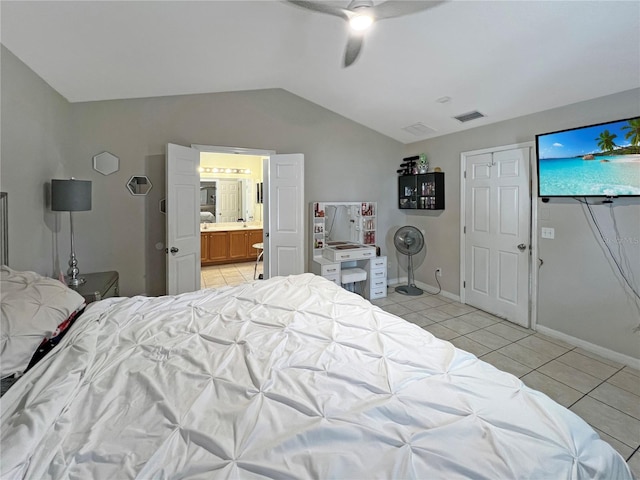 8439 Adele Rd, Lakeland, FL 33810 - bedroom with light tile patterned flooring, visible vents, vaulted ceiling, ceiling fan, and baseboards