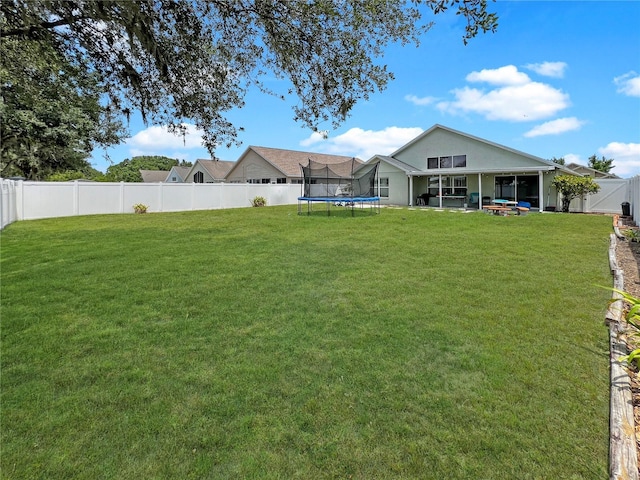 8439 Adele Rd, Lakeland, FL 33810 - view of yard featuring a trampoline and a fenced backyard