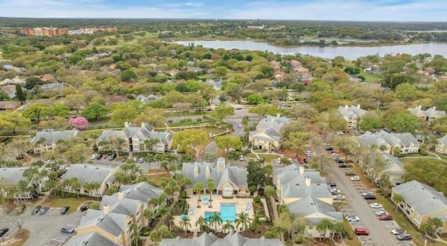 bird's eye view with a residential view and a water view