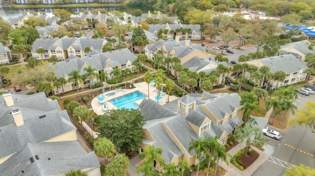 aerial view featuring a water view and a residential view