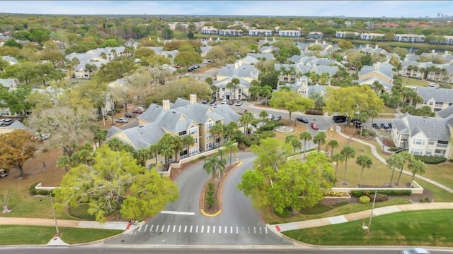 birds eye view of property with a residential view